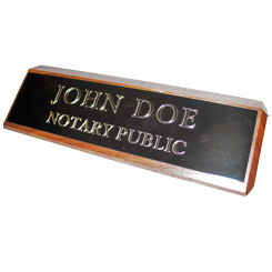 This elegant, genuine Tennessee notary walnut desk, sign is made of solid wood and engraved on a metal plate with gold lettering with your notary name and the wording 'Notary Public'. It makes a fine addition to any desk or office. This sign can be customized with up to two lines.